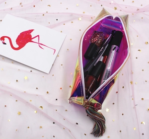Detailed shot of laser iridescent PVC stationery pouch with a colorful silk tassel zipper