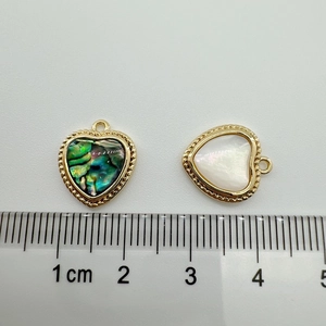 18K gold-plated heart charms with abalone shell and mother of pearl on a white background