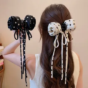 Elegant polka dot rose hair claw clips with long ribbon streamers for high ponytail styling