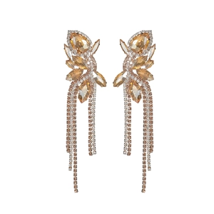 Detail of elegant bow tassels earrings featuring champagne crystals and rhinestones