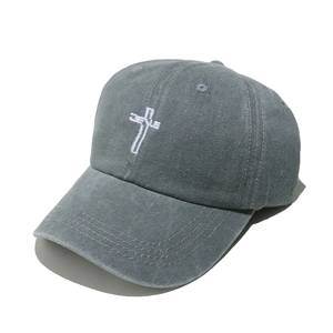 Detail of washed grey baseball cap with Jesus cross embroidery and reinforced visor stitching