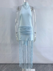 Detailed view of light blue halter neck dress featuring pleated waist and long flowing tassels