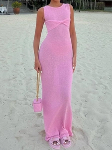 Pink sleeveless knit maxi dress with twist detail for summer beach vacations