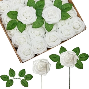 Detail of boxed white artificial PE foam roses with green leaves and flexible wire stems