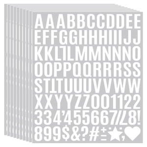 Detail showing stacked sheets of self-adhesive white vinyl alphabet and number stickers