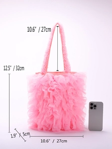 Size specifications of pink ruffled tulle tote bag with phone for scale comparison