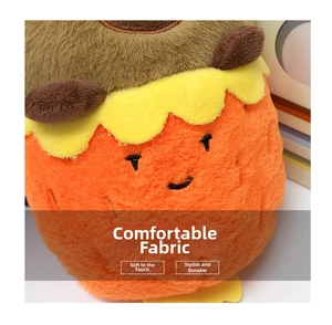 Close-up of soft orange plush fabric with detailed embroidery on a Capybara doll bag