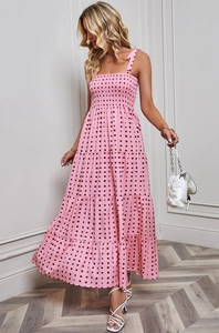 Detail of pink polka dot maxi dress featuring smocked bodice and tie-shoulder straps