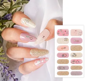 Detail of YS-011 floral nail wraps in nude pink with fine glitter and dried flower accents