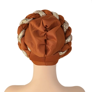 Detailed back view of a brown turban hat with sparkling gold sequin braid details