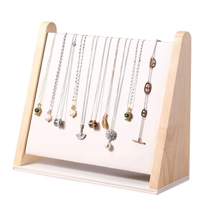 Vertical wooden jewelry display stand with white panel for hanging multiple necklaces