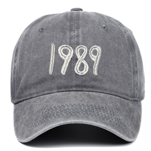 Detailed view of 1989 embroidery on vintage washed dark grey cotton baseball cap