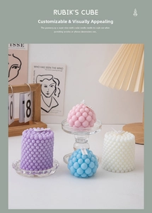 Detailed view of bubble cube candles in pastel pink, purple, blue and white colors