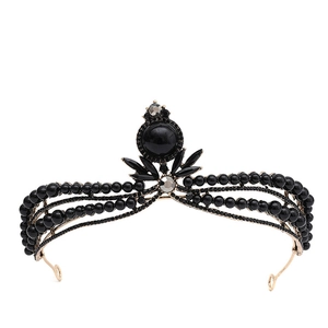 Macro detail of black pearls and rhinestones on baroque vintage bridal crown