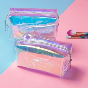 Close-up of two holographic TPU makeup bags in different sizes with silver zippers