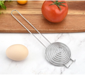Macro view of stainless steel spiral egg separator on a marble kitchen counter