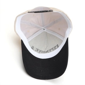 Interior detail of the five-panel baseball cap showing stitching and snapback closure