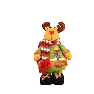 Standing Christmas reindeer plush toy with red nose and star decorated festive holiday outfit