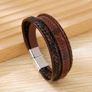 Close-up of multilayer braided leather bracelet with silver magnetic alloy clasp