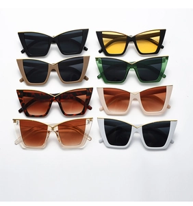 Collection of oversized cat-eye sunglasses featuring chic gold V-shaped metal frame accents