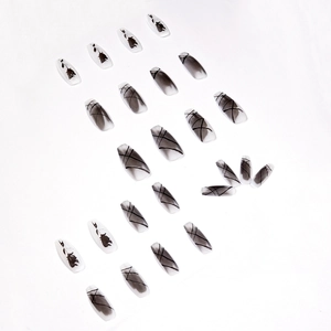 Black and white coffin false nails featuring gothic dark rose silhouettes and ink art patterns