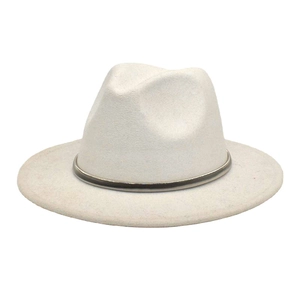 Detail of white wool fedora hat featuring a stylish dark metal buckle decorative band