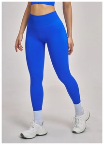 Close-up of seamless electric blue high-waisted yoga pants with ribbed compression waistband