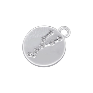 Close-up of a silver circular zodiac pendant with inlaid Taurus constellation gems