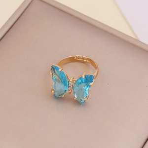 Adjustable gold butterfly ring with sky blue gemstone wings and zircon accents