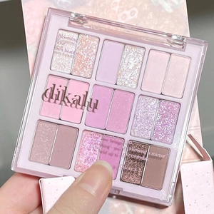 Close-up of DIKALU 18-color eyeshadow palette showing matte and glitter textures