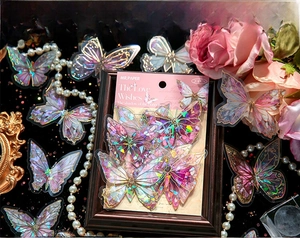 Detail of laser-cut butterfly stickers with iridescent gold foiling for scrapbooking