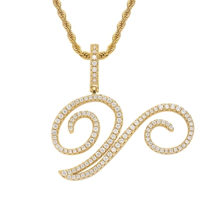 Detailed macro view of 18K gold letter V pendant with pavé-set zircons and rope chain