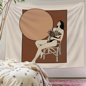 Bohemian wall tapestry with female silhouette illustration hanging in a cozy bedroom