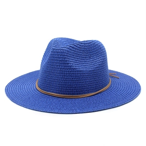 Close-up of royal blue straw fedora with fine weaving and brown leather cord detail