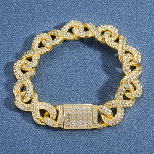 Iced out gold Cuban link bracelet with sparkling rhinestones and a secure box clasp