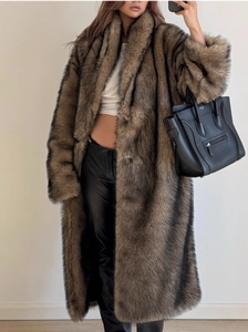 Detail of long brown faux fur coat showing plush texture and luxurious shawl collar style