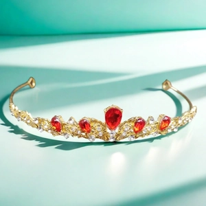 Luxury gold bridal tiara with red teardrop crystals and sparkling zircon details