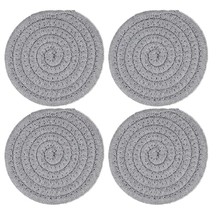 Set of 4 grey round braided cotton coasters in a symmetric 2x2 grid on white background