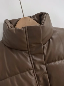 Detailed view of brown faux leather quilted vest collar with high-quality texture