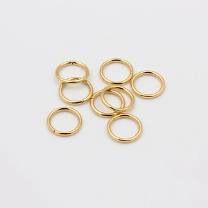 Detailed macro view of 18k gold-plated stainless steel open jump rings for DIY jewelry making