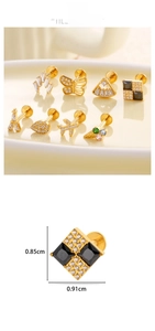 Macro shot of titanium gold flat-back ear studs featuring zircon-set creative shapes