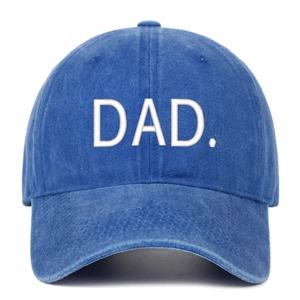 Close-up of DAD embroidery on blue washed denim baseball cap with premium texture