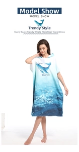 Detail of hooded microfiber beach poncho with whale print and blue gradient ocean pattern