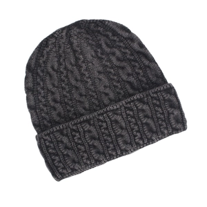 Close-up of deep gray cable knit beanie showing detailed texture and warm ribbed cuff