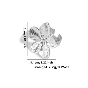 Detailed view of flower ring dimensions 3.1cm x 3cm with brushed steel texture