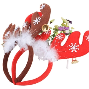 Christmas headbands featuring brown reindeer antlers, white feathers and golden bells