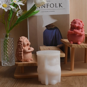 Detailed 3D silicone mold with hedgehog holding apple figurines for DIY candle making