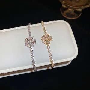 Elegant floral zircon bracelet set in silver and gold finishes with micro-pave detailing