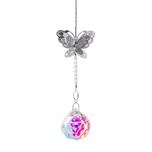 Detailed view of silver butterfly metal craft with iridescent crystal ball prism pendant