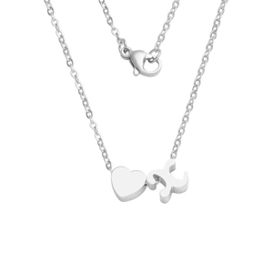 Macro view of mirror finish stainless steel heart and letter X pendant necklace